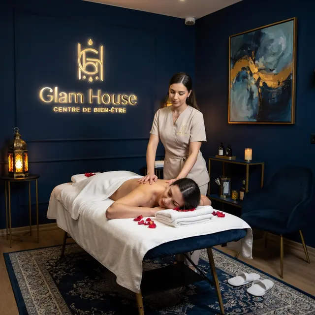 Luxury spa Glam House Casa in Casablanca: massage in a navy treatment room lit by a Moroccan lantern